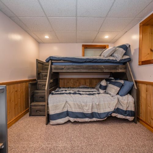 The kids bed bunk has a double bed on the bottom, and single bed on top, with storage-steps to get up.