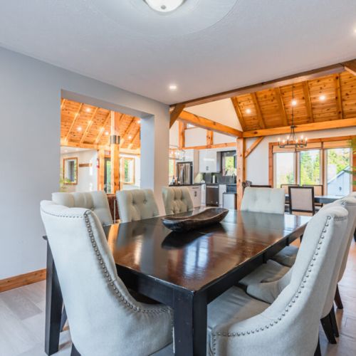 The upper dining area has a luxurious table perfect for family feasts and morning meals.