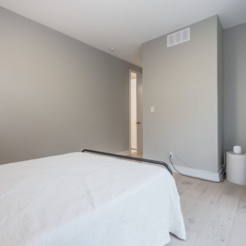 Descend into the cozy basement retreat featuring a comfortable double bed, offering a private haven for a restful night's sleep. Thoughtfully designed, this bedroom provides a tranquil escape for guests seeking a bit of seclusion.