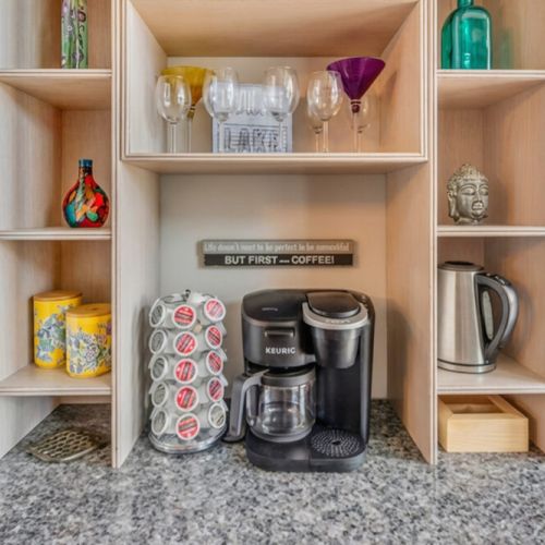 Start your day with a fully equipped coffee station and stylish storage. A thoughtful touch for guests who love cozy, well-appointed travel stays.