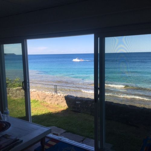 Lounge inside while watching boats drift by.