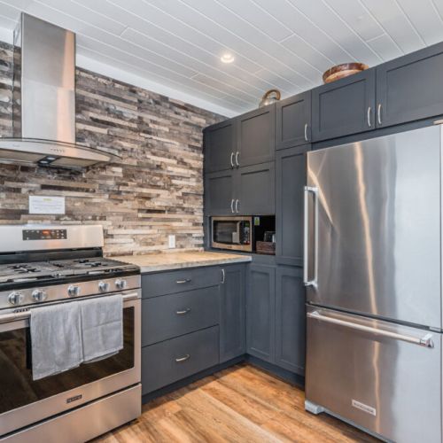 Spacious, fully equipped kitchen featuring premium finishes and plenty of prep space.