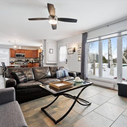 Sun-filled living space with energy-efficient windows and updated flooring throughout.