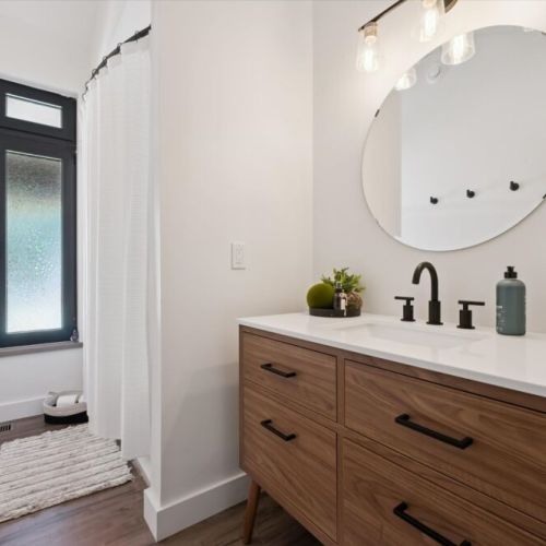 Stylish modern bathroom stocked for your stay and daily routines.