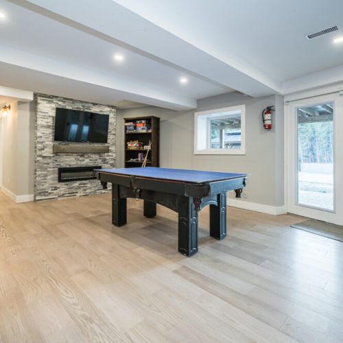 Engage in a friendly game of table tennis or pool in a room crafted for memorable moments set in a bright and inviting space. With easy access to the fresh air and natural light streaming in, this recreation room is the perfect backdrop for your most cherished vacation stories.
