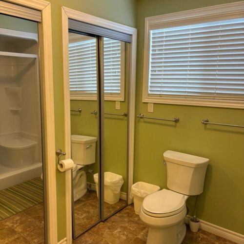 Clean, spacious bathroom with plenty of room for getting ready.
