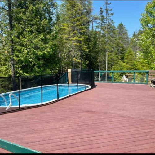 Soak up the sun on a spacious deck with a private pool surrounded by nature—perfect for summer escapes and outdoor fun.