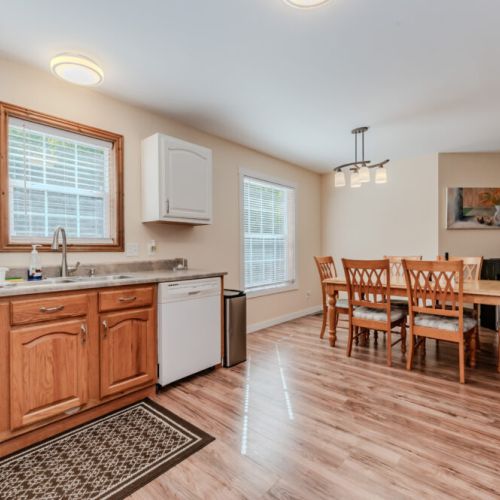 Enjoy home-cooked meals in this fully equipped kitchen with all the essentials, including a spacious dining area for gathering with family and friends.