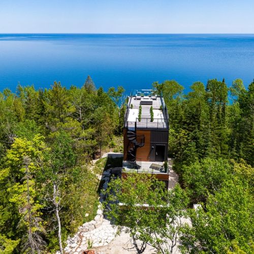 Clean lines and modern design rise effortlessly from the trees. Borchardt Lookout is a thoughtfully designed architectural home where nature remains the focal point.