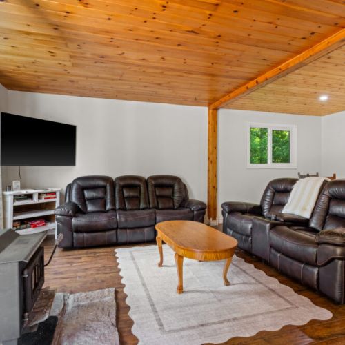 Kick back in the comfortable living room with Smart TV and cozy seating.