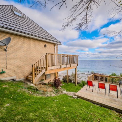 Relax on the private waterfront deck with stunning, uninterrupted views of the crystal-clear waters of Georgian Bay, perfect for soaking in the beauty of nature.
