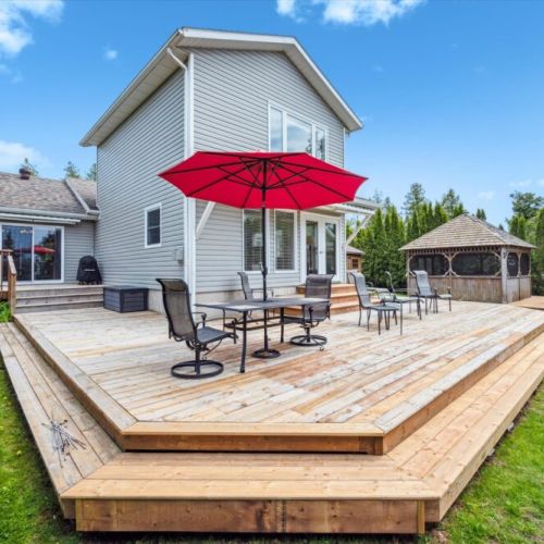 Gather with friends or family on the expansive wraparound deck — perfect for outdoor dining, lounging, or stargazing.