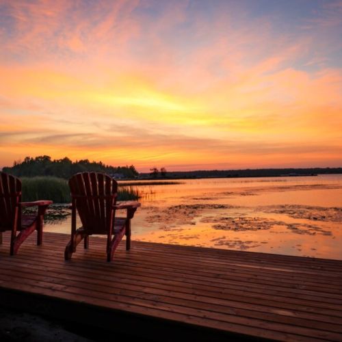 Cozy up in the red chairs on the dock and watch the sky light up with unreal Stokes Bay sunsets.