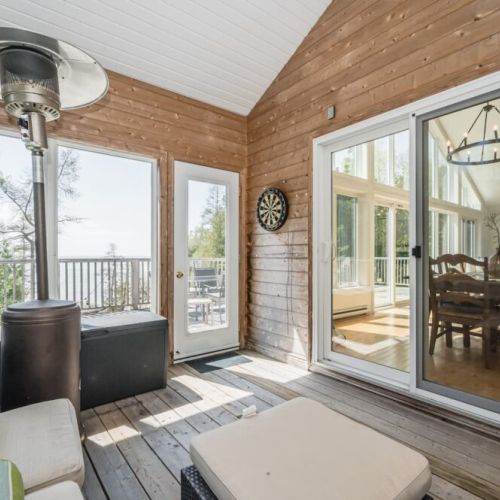 The screened in Peninsula Room is perfect for dining outside without being annoyed by bugs.