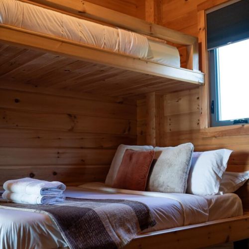 Perfect for families—queen bunk bed with twin above and pull-out below.