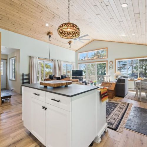 The open-concept design keeps everyone connected, whether you're cooking in the kitchen or relaxing in the living room.