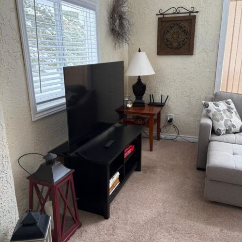 Entertainment corner with TV and extra space to settle in and feel right at home.