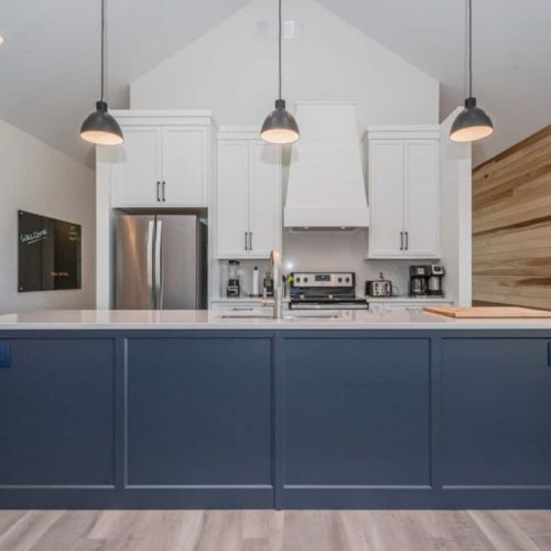 The main kitchen island is a stunning example of modern design and the perfect spot to entertain the family.