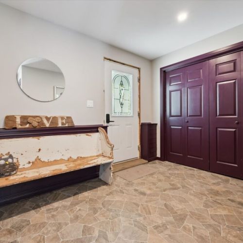 Spacious entry area with coat hooks and storage — perfect for boots and gear after outdoor adventures.