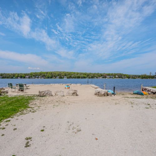 Your own personal slice of paradise, where the gentle breeze and the shores of Little Lake await your presence.