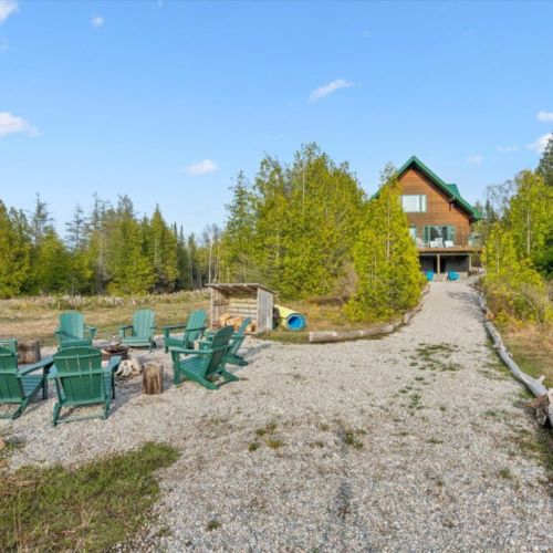 Gather around the fire pit for unforgettable evenings by the water at Paradise Pines.