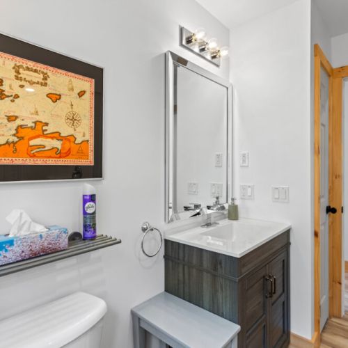 A bright, modern bathroom provides extra convenience for families and groups.