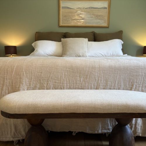 The Master bedroom with ensuite bathroom and crib.
