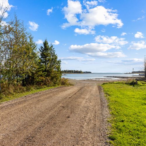 Just minutes away, enjoy easy access to the beautiful shoreline of Lake Huron for swimming, paddling, and unforgettable sunsets.
