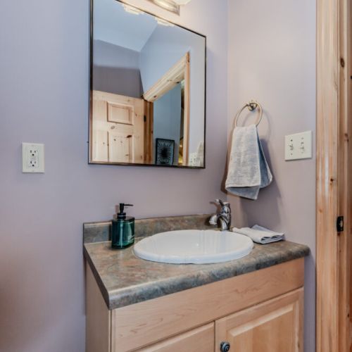 Compact powder room with stylish finishes—ideal for quick freshen-ups during your stay.