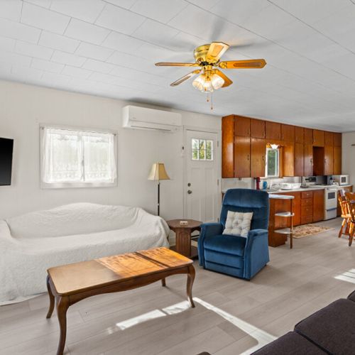 The open-concept living space connects comfortably with the kitchen and dining area, making it easy to spend time together.