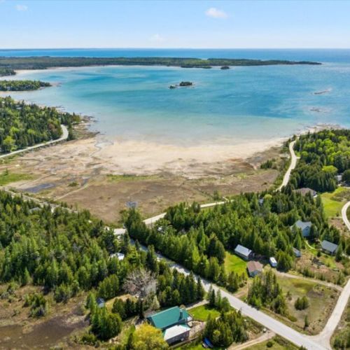 Scenic aerial perspective of the surrounding waterfront and natural beauty.