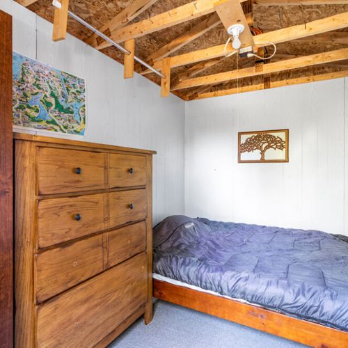 One of two seasonal bunkies provides a cozy, rustic space for additional sleeping or relaxing.