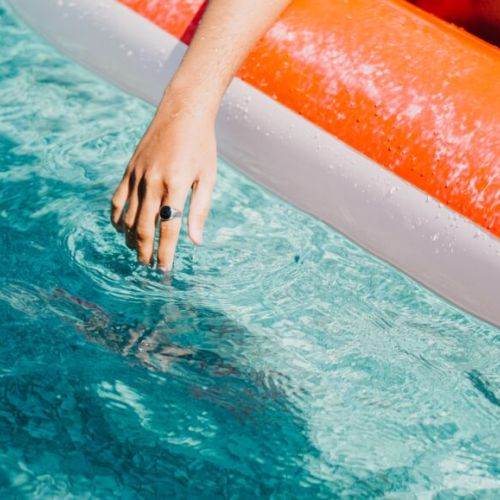 Watch the kids float in the gorgeous aqua blue waters of Dorcas Bay.