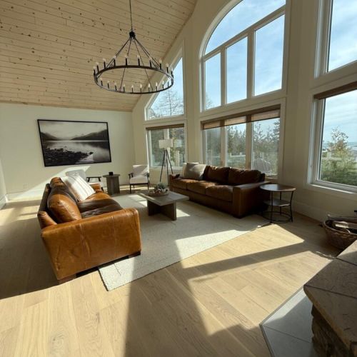 Bask in natural light and panoramic forest views from the vaulted-ceiling great room—your scenic cottage getaway awaits.