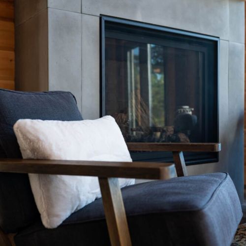 Curl up with a book or coffee by the inviting hearth—comfort meets style.