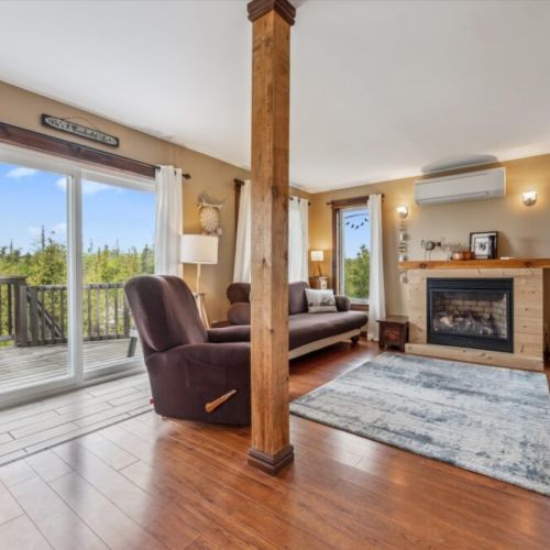 Cozy and inviting living room featuring a gas fireplace, smart TV, and plenty of seating for relaxing after a day of exploring.
