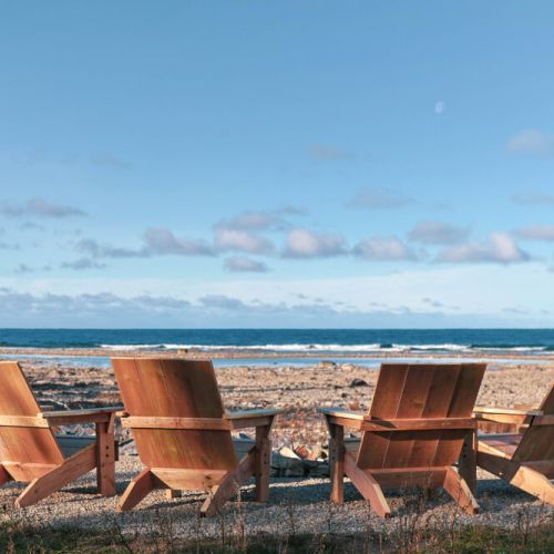 Immerse yourself in breathtaking Lake Huron views. This 1.1-acre property feels like an island retreat, with sounds of nature. Enjoy a spacious backyard, a separate fire pit, and the best sunset spot in Tobermory.