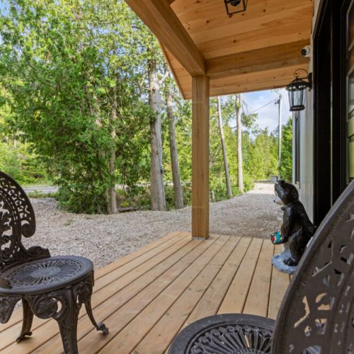 Sip your morning coffee on the covered front porch surrounded by nature.