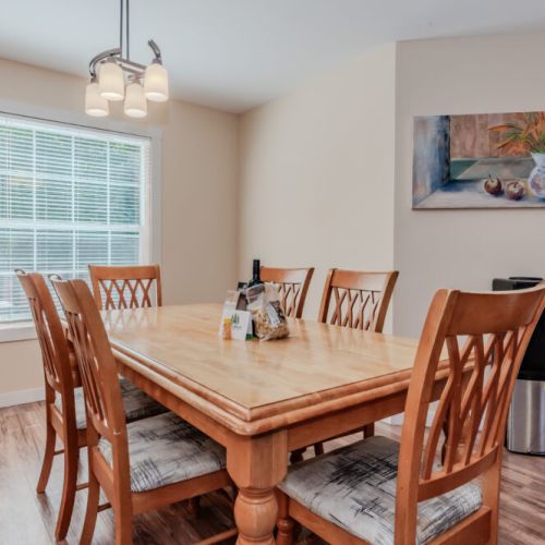 Enjoy meals with family and friends in this well-lit dining area, perfect for gathering around the table after a day of adventure.