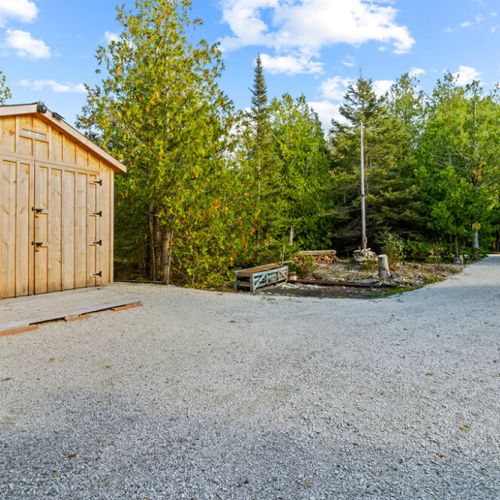 A large driveway provides plenty of parking with easy access to the cottage and surrounding property.
