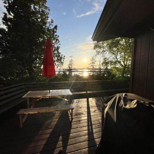 Take in the serene views from the extended deck, complete with built-in benches and surrounded by mature trees. This private outdoor living space offers a tranquil escape.