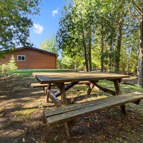 Enjoy outdoor meals at the picnic table surrounded by the peace and privacy of the forest.