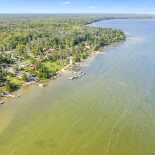 Crystal-clear, spring-fed Miller Lake — excellent for swimming, boating, and peaceful mornings on the dock.