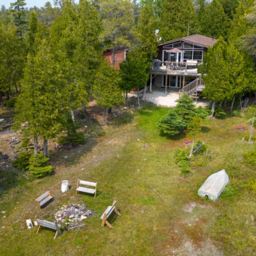 Large yard with firepit great for gatherings of family and friends.
