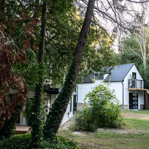 Private garage loft building tucked into the trees for extra room and privacy.