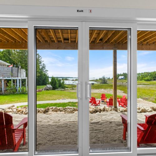Wake up to beautiful views overlooking the fire pit and Hay Bay.