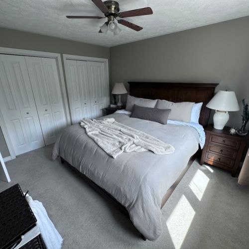 Spacious king bedroom with a smart TV (not pictured), Netflix, Prime Video, and a selection of books for cozy evenings indoors.