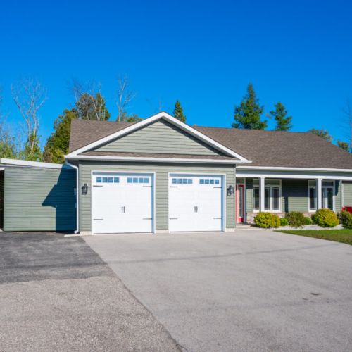 Enjoy easy access with a two-car garage and charming exterior—perfect for families or group road trips.