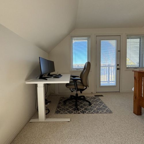 Enjoy a workspace with a view: The second Guest bedroom with a dedicated workspace, allowing for inspiration to flow from the stunning lake vistas anytime of day.