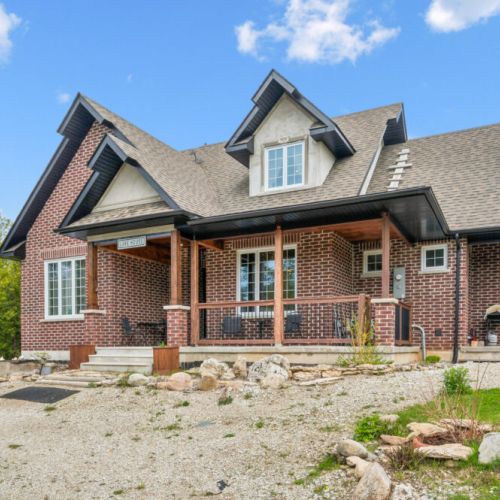 A beautifully crafted brick cottage offering comfort, character, and a welcoming country-lake atmosphere.